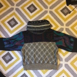 ‘Urban Renewal’ Turtle neck sweater.
